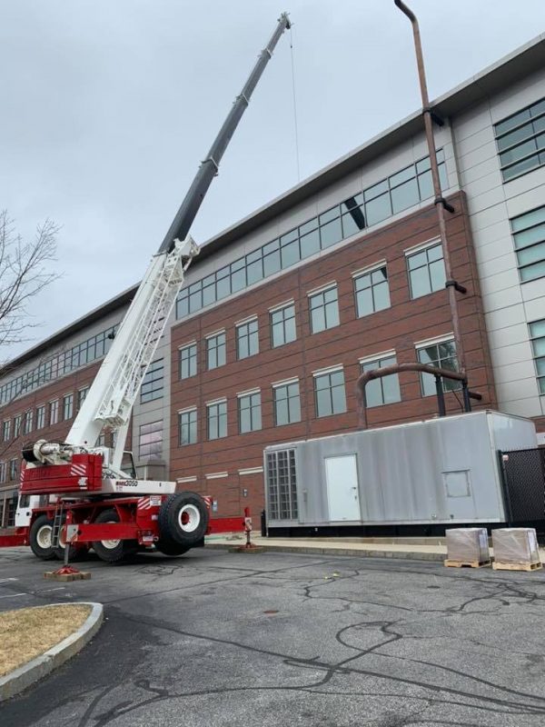 Crane rental in Boxborough, MA by Martel Crane Service & Tree Removal. Crane Rented to lift large filters a top a building
