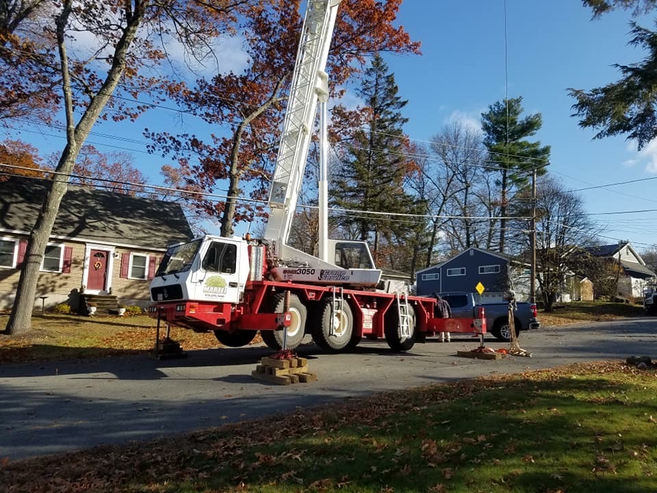 The crew and crane had to use the roadway to setup for this tree removal job in Dracut, MA