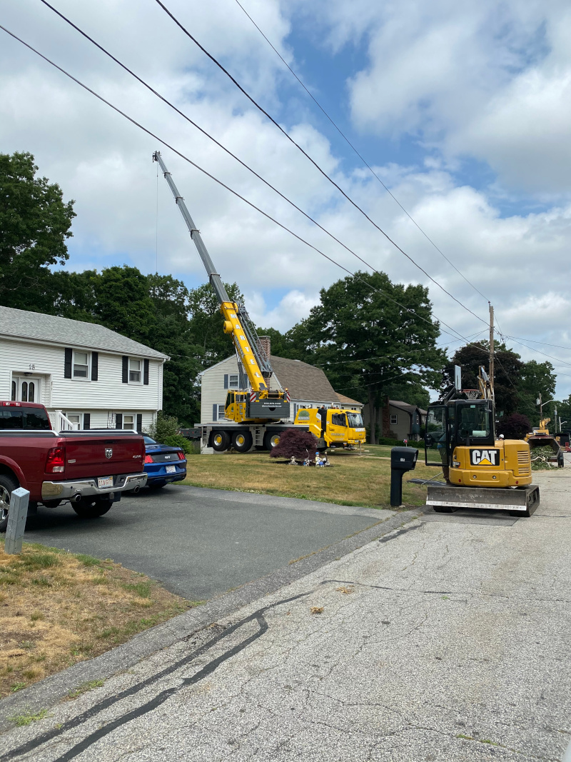The crew setup in the driveway to safely remove trees from the back of the property in Billerica, MA.

