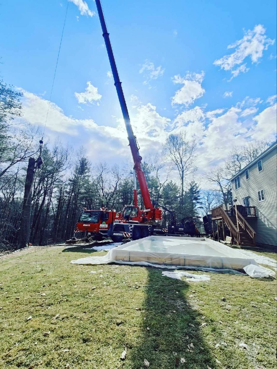 Martel Crane and Tree removed trees to open up the backyard for this resident in Dracut, MA. 