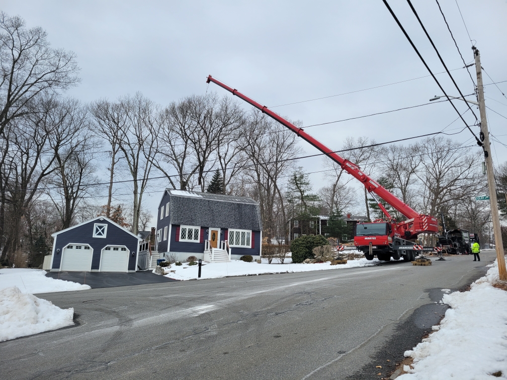 Martel Crane and Tree Service removed tall oaks from this property in Billerica, MA.

