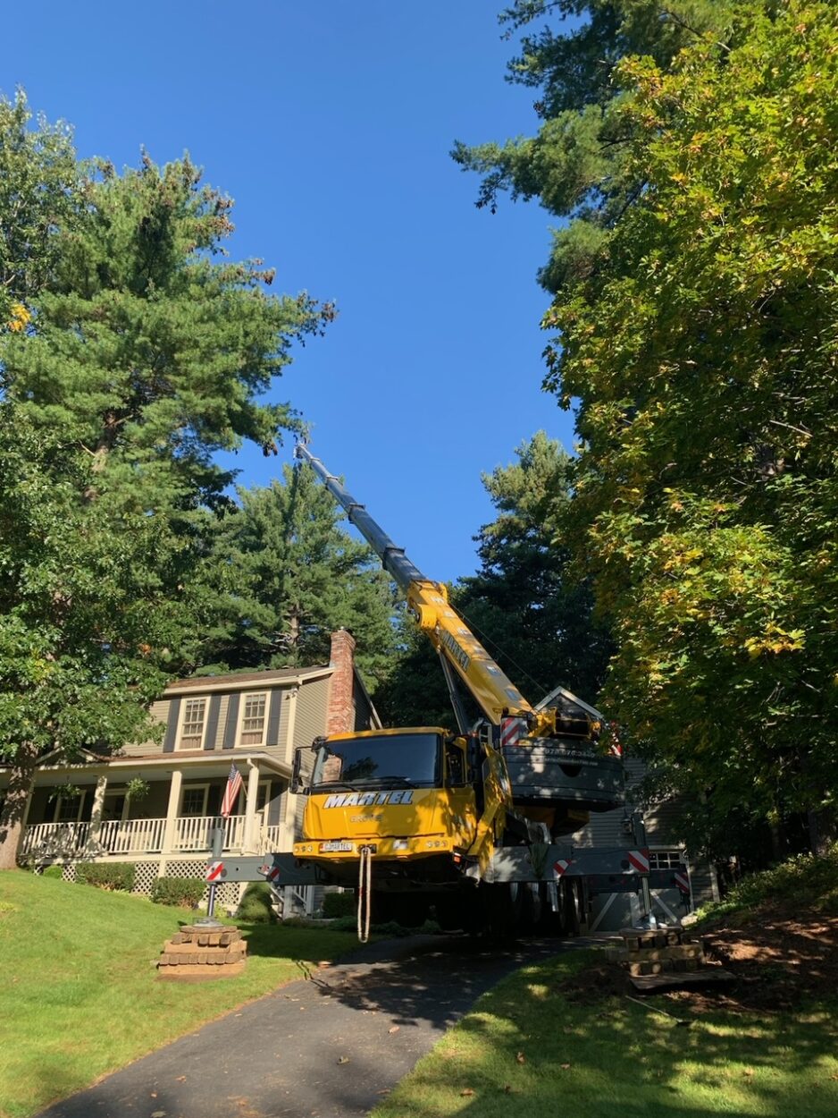 For this job in Westford, MA, Martel Crane & Tree used the 100 ton crane to safely remove trees from the backyard.

