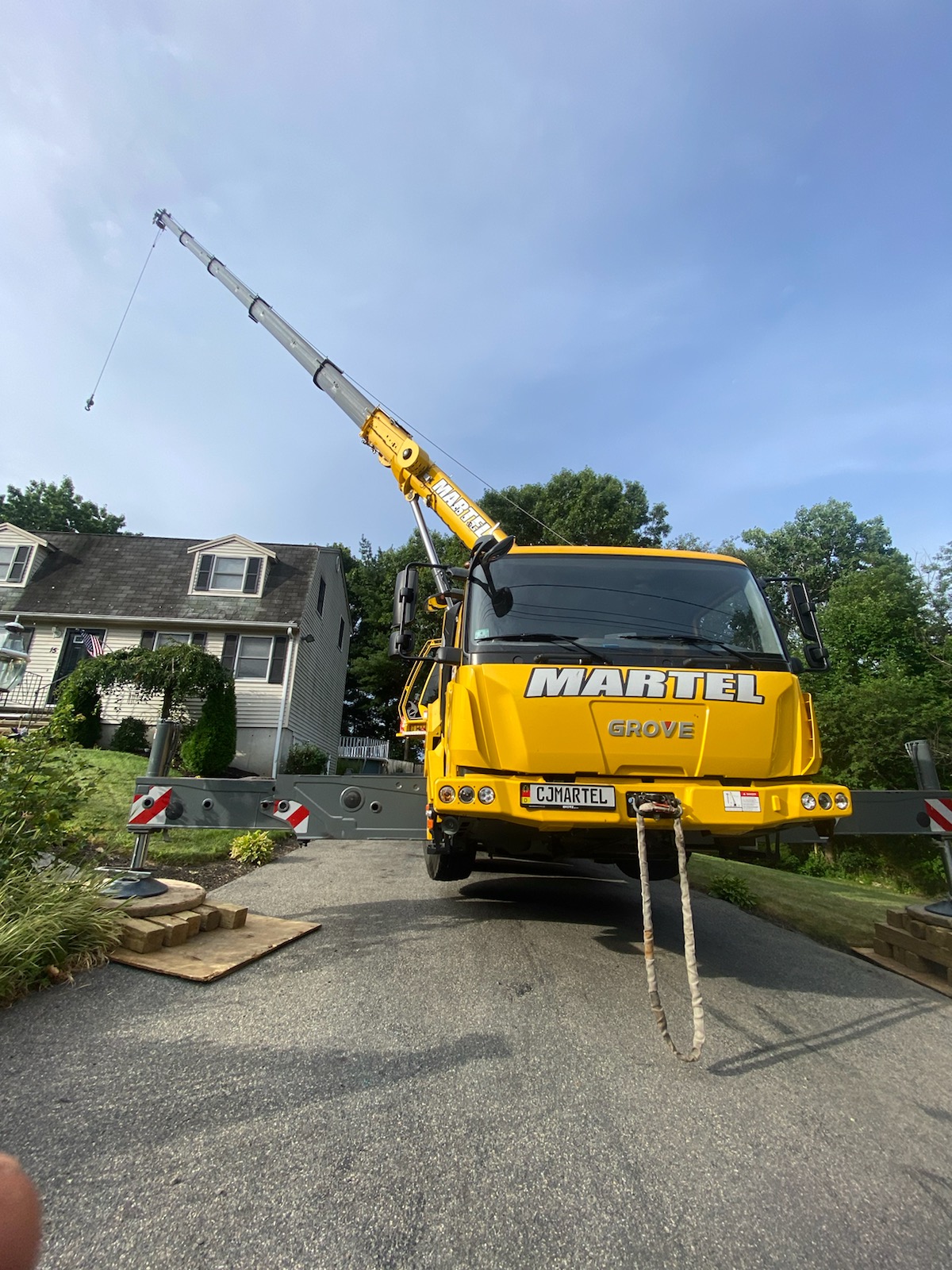 The crew from Martel Crane and Tree used the long reach of the crane to safely remove trees from this property in Billerica, MA.