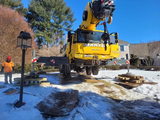 We setup the 100 ton crane in the snow to safely remove trees from this residence in Wayland, MA.