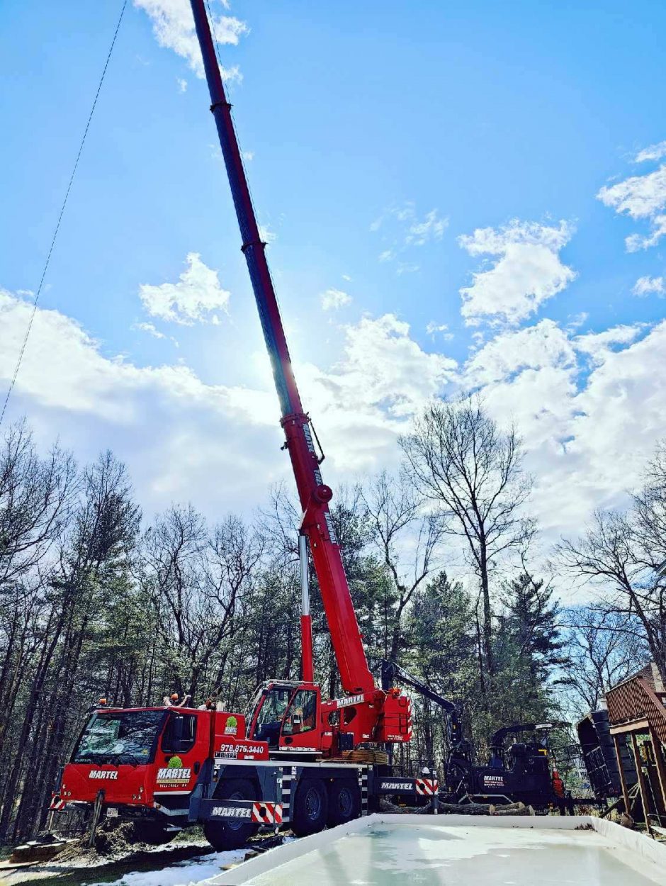 Martel Crane and Tree removed trees to open up the backyard for this resident in Dracut, MA. 